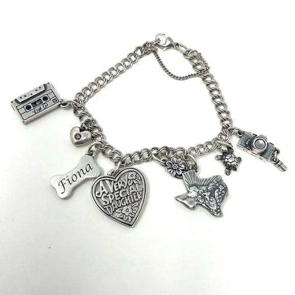 JAMES AVERY sterling silver charm bracelet, 8 charms Bracelets